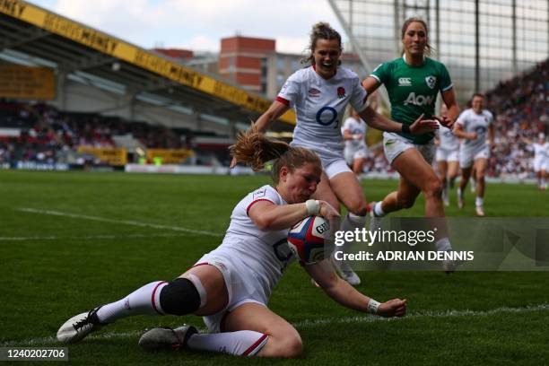 England's wing Lydia Thompson scores a try during the Six Nations international women's rugby union match between England and Ireland at Mattioli...