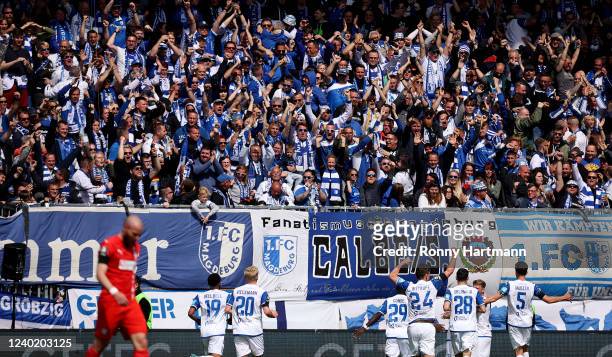 Players and fans of Magdeburg celebrate the opening goal during the 3. Liga match between 1. FC Magdeburg and FSV Zwickau at MDCC Arena on April 24,...