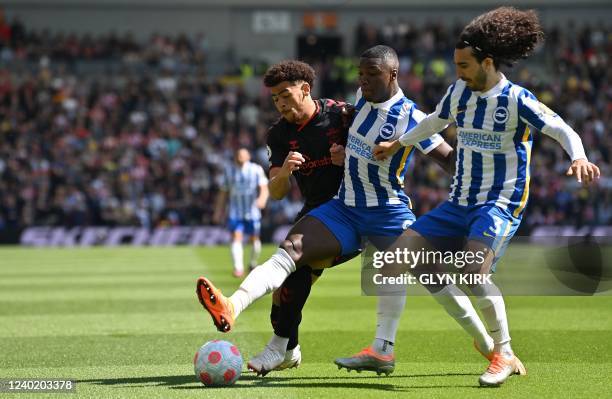 Brighton's Spanish defender Marc Cucurella vies with Southampton's English midfielder Che Adams during the English Premier League football match...