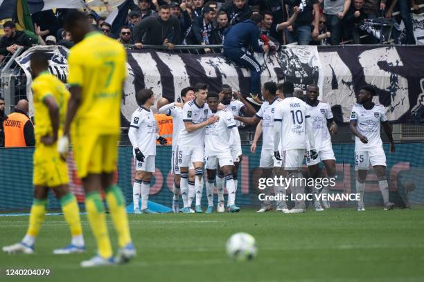 Bordeaux's Dutch midfielder Javairo Dilrosun is congratulated by teammates after scoring a goal during the French L1 football match between FC Nantes...