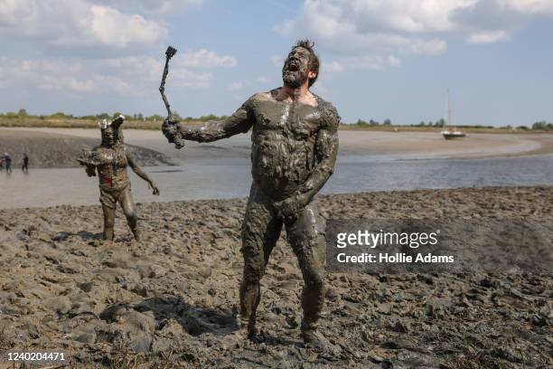 Competitors participate in the Maldon Mud Race on April 24, 2022 in Essex, England. The annual race resumed after two years' hiatus due to Covid-19.