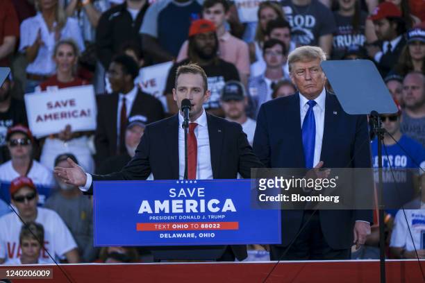 Max Miller, a Republican candidate for U.S. Representative from Ohio, speaks on stage with former U.S. President Donald Trump listens during a 'Save...