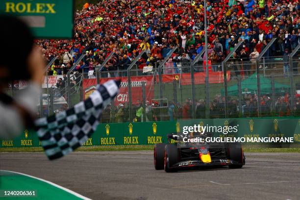 Red Bull Racing's Dutch driver Max Verstappen crosses the line to win the Emilia Romagna Formula One Grand Prix at the Autodromo Internazionale Enzo...