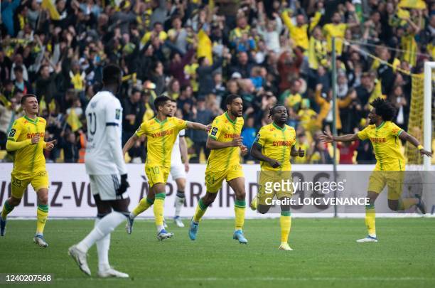Nantes' Nigerian midfielder Moses Simon celebrates with teammates after scoring during the French L1 football match between FC Nantes and Bordeaux at...