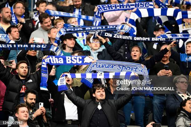 Hertha fans display their scarves during the German first division Bundesliga football match Hertha BSC v VfB Stuttgart at the Olympic Stadium in...