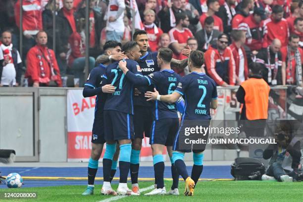 Hertha Berlin's German forward Davie Selke celebrates scoring the opening goal with his teammates during the German first division Bundesliga...