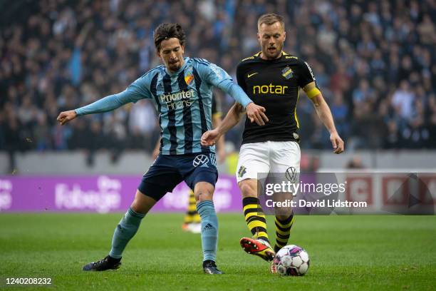 Gustav Wikheim of Djurgardens IF and Sebastian Larsson of AIK during the Allsvenskan match between AIK and Djurgardens IF at Friends Arena on April...