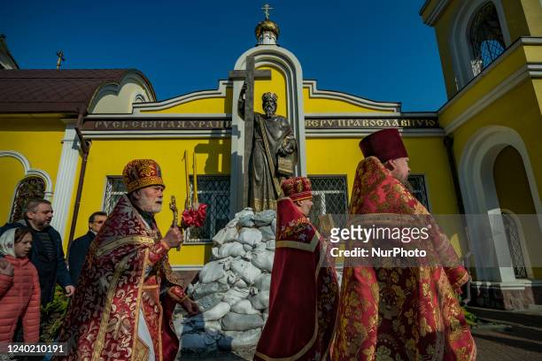 Orthodox priests marches in a procession during the celebrations of the Orthodox Easter in Dnipro city, Ukraine. Sculpture of the local saint is...