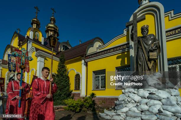 Procession around a church during the celebrations of the Orthodox Easter in Dnipro city, Ukraine. Sculpture of the local saint is protected with...