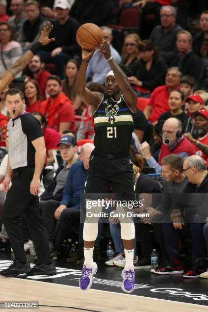 Jrue Holiday of the Milwaukee Bucks shoots a three point basket during the game against the Chicago Bulls during Round 1 Game 4 of the NBA Playoffs...