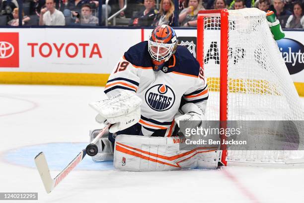 Goaltender Mikko Koskinen of the Edmonton Oilers plays the puck during the first period of a game against the Columbus Blue Jackets at Nationwide...
