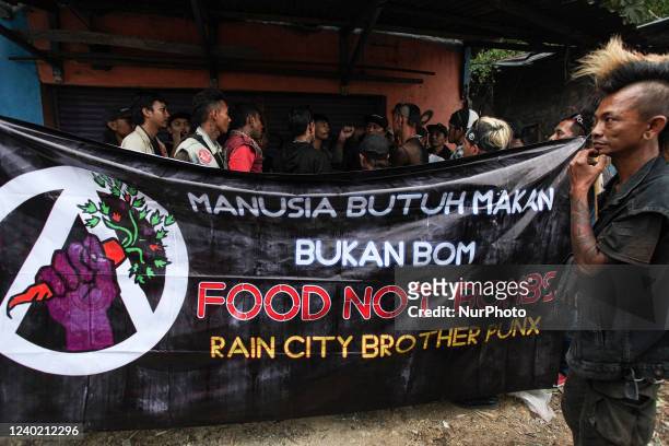 Indonesian street musicians in punk outfits prepare distribute food boxes of Iftar during the Islamic holy month of Ramadan in Bogor, West Java,...