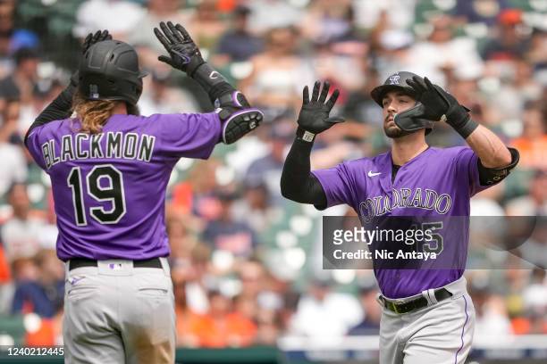 Randal Grichuk of the Colorado Rockies celebrates hitting a home run with Charlie Blackmon against the Detroit Tigers during the top of the third...