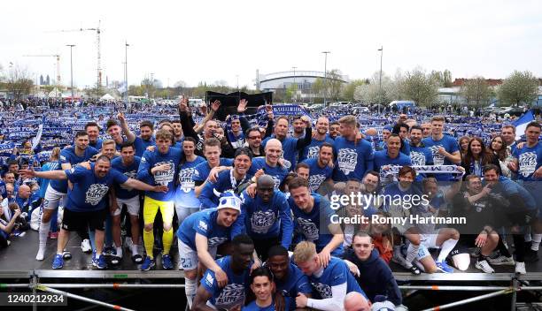 Players of Magdeburg celebrate promotion to the Second Bundesliga with fans after the 3. Liga match between 1. FC Magdeburg and FSV Zwickau at MDCC...