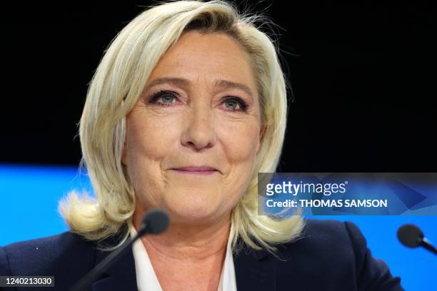 French far-right party Rassemblement National presidential candidate Marine Le Pen reacts at the Pavillon d'Armenonville in Paris on April 24, 2022...