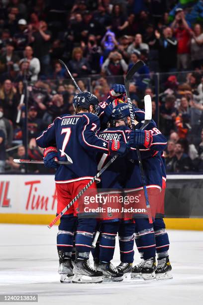 Nick Blankenburg of the Columbus Blue Jackets celebrates his first NHL goal with teammates in the third period against the Edmonton Oilers at...