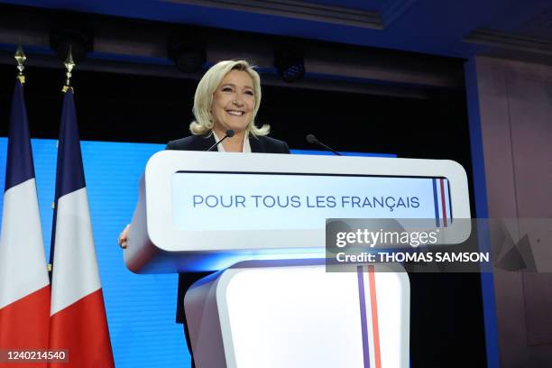 French far-right party Rassemblement National presidential candidate Marine Le Pen smiles after delivering a speech at the Pavillon d'Armenonville in...