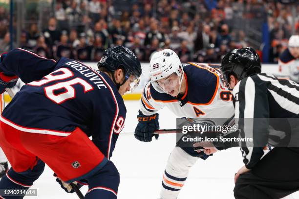 Columbus Blue Jackets center Jack Roslovic and Edmonton Oilers center Ryan Nugent-Hopkins prepare to face-off in the third period during the game...