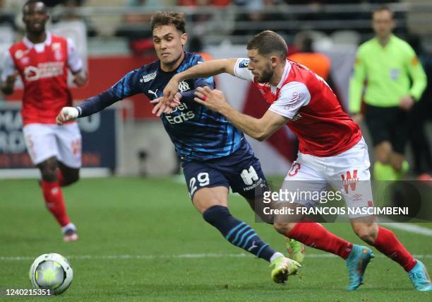 Reims' Kosovar forward Arber Zeneli fights for the ball with Marseille's Spanish defender Pol Lirola during the French L1 football match between...