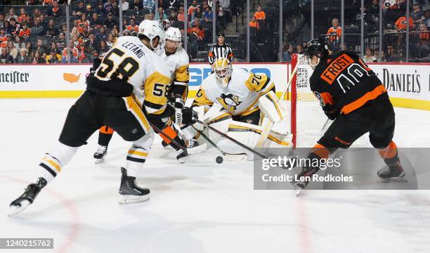 Morgan Frost of the Philadelphia Flyers attempts a scoring chance against goaltender Louis Domingue, Kris Letang, and Mike Matheson of the Pittsburgh...