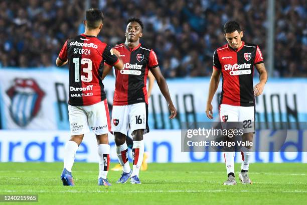 Djorkaeff Reasco, Juan Sforza and Manuel Cappaso of Newell´s Old Boys react after a match between Racing Club and Newell's Old Boys as part of Copa...