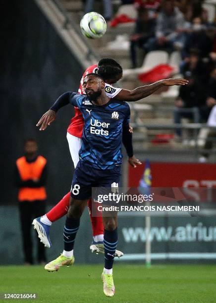 Reims' French defender Andreaw Gravillon fights for the ball with Marseille's Brazilian midfielder Gerson during the French L1 football match between...