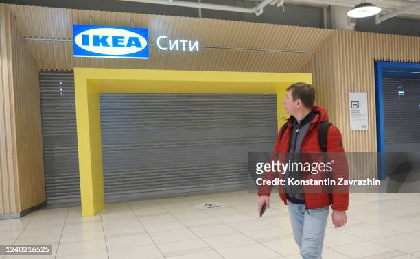 Man walks by Sweden-based home decor store IKEA, closed due to the military invasion of Ukraine, April 24, 2022 in Belaya Dacha, outside of Moscow,...