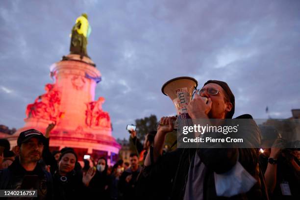 Protesters of centrist incumbent President Emmanuel Macron's apparent defeat of far-right rival Marine Le Pen for a second five-year term gather on...