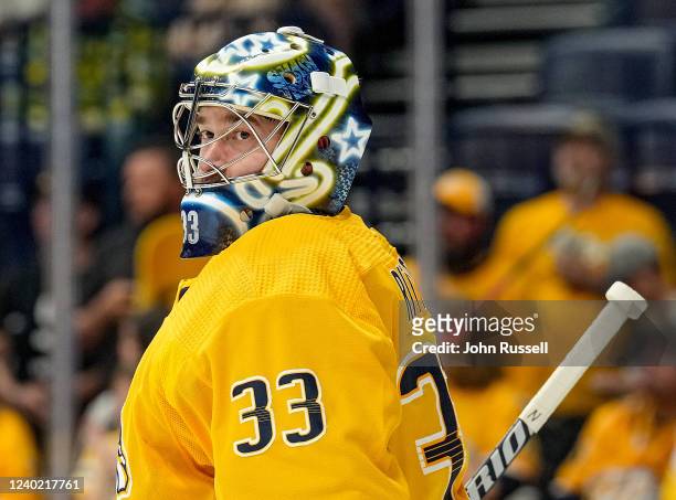 David Rittich of the Nashville Predators skates in warm-ups prior to the game against the Minnesota Wild during an NHL game at Bridgestone Arena on...