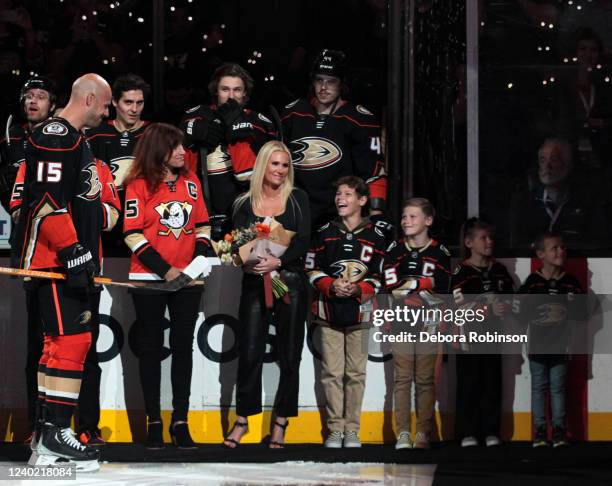 Ryan Getzlaf of the Anaheim Ducks meets with his family during his retirement ceremony prior to his last career NHL game before the game between the...