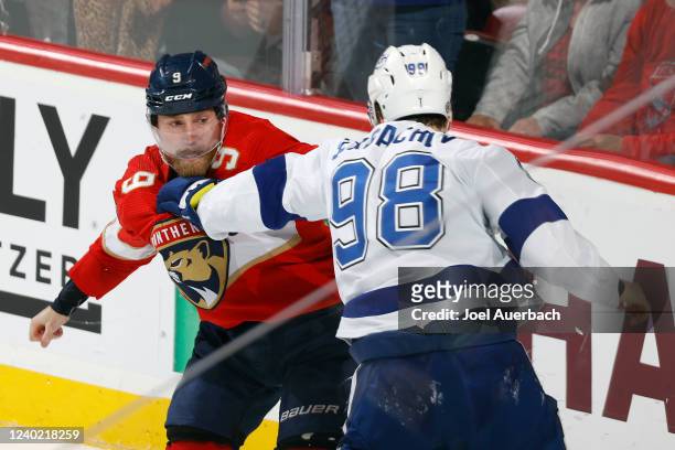 Mikhail Sergachev of the Tampa Bay Lightning and Sam Bennett of the Florida Panthers fight during second period action at the FLA Live Arena on April...
