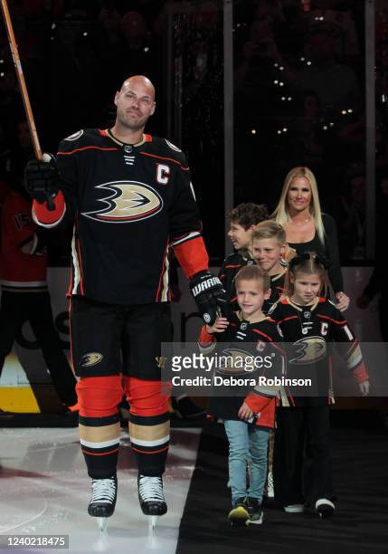Ryan Getzlaf of the Anaheim Ducks walks on the ice with his family during his retirement ceremony prior to his last career NHL game before the game...
