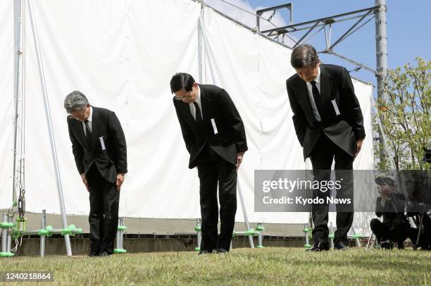 West Japan Railway Co. President Kazuaki Hasegawa observes a moment of silence at the site of the 2005 fatal train derailment in the western Japan...