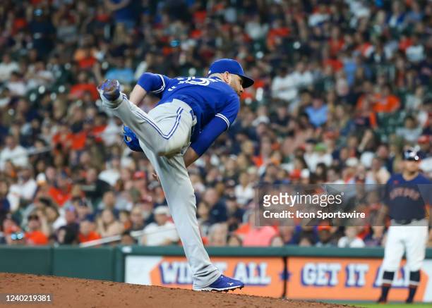 Toronto Blue Jays relief pitcher David Phelps watches his pitch in the bottom of the seventh inning during the baseball game between the Toronto Blue...