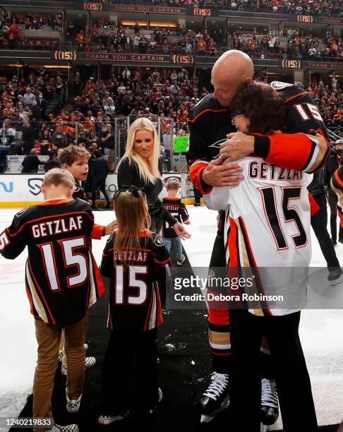 Ryan Getzlaf of the Anaheim Ducks hugs his family after his last career NHL game after the game against the St. Louis Blues at Honda Center on April...