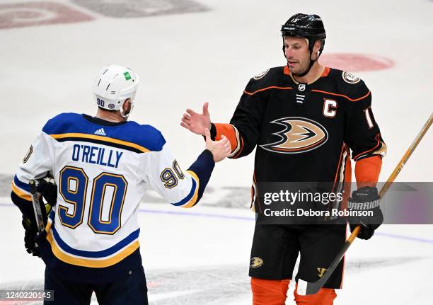 Ryan Getzlaf of the Anaheim Ducks celebrates his last career NHL game with Ryan O'Reilly of the St. Louis Blues after the game at Honda Center on...