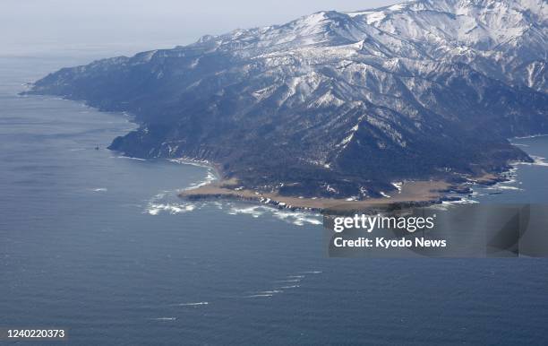 Photo taken on April 25 from a Kyodo News helicopter shows a fleet of ships searching for a tourist boat that went missing with over 20 passengers...