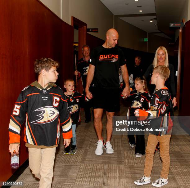 Ryan Getzlaf of the Anaheim Ducks walks with his family after his last career NHL game after the game against the St. Louis Blues at Honda Center on...