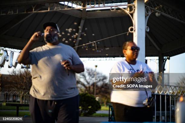 Jebel Jones of Gahanna, Ohio and Jamille Jones of Gahanna, the organizers for âPint Sized Protestersâ blow bubbles in remembrance at a Community...