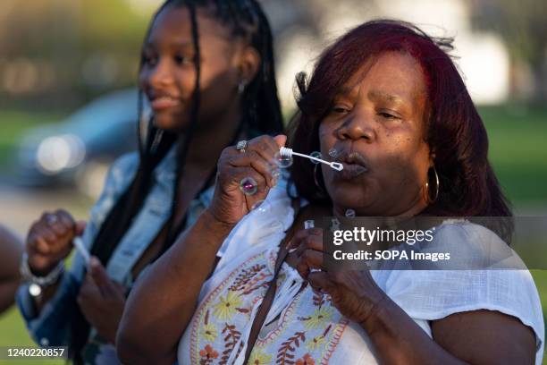 JaâNiah Bryant MaâKhia Bryantâs younger sister, and Jeanene Hammonds, MaâKhia Bryantâs grandmother, blow bubbles at the Community Vigil for...