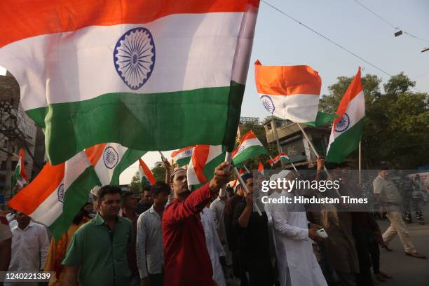 People of Jahangirpuri participate in Tiranga Yatra, days after violence and encroachment drive, on April 24, 2022 in New Delhi, India. People from...