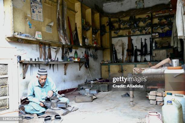 Pakistani man manufactures a weapon at his gun shop in Darra Adam Khel village, in Peshawar, Pakistan on April 20, 2022. The Pakistani city of Darra...