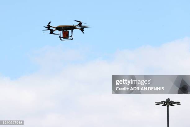 Drone carrying a box of Prosecco takes off from the launch pad at the world's first vertiport for flying taxis and autonomous delivery drones, at the...