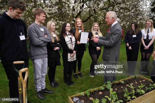 Prince Charles, Prince of Wales meets children from Robert Burns Academy, winners of the food waste solution challenge, who have been learning about...
