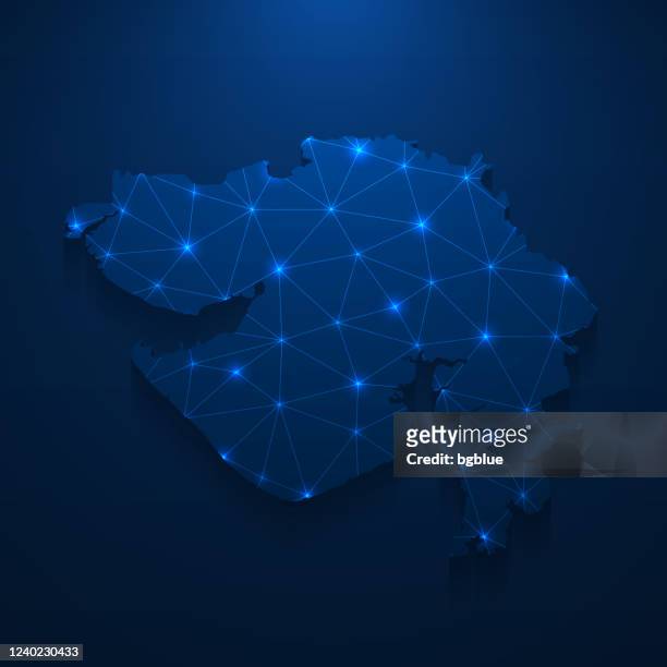 gujarat map network - bright mesh on dark blue background - gujarat stock illustrations