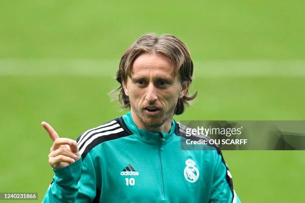 Real Madrid's Croatian midfielder Luka Modric reacts as he takes part in a team training session at the Etihad Stadium in Manchester, north west...
