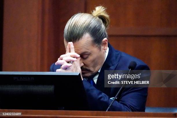 Actor Johnny Depp testifies in the courtroom at the Fairfax County Circuit Courthouse in Fairfax, Virginia, April 25, 2022. - Actor Johnny Depp sued...