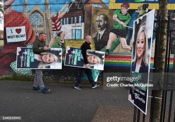 Sinn Féin election workers carry election posters on the Falls road April 25, 2022 in Belfast, Northern Ireland. Sinn Fein could emerge from the May...