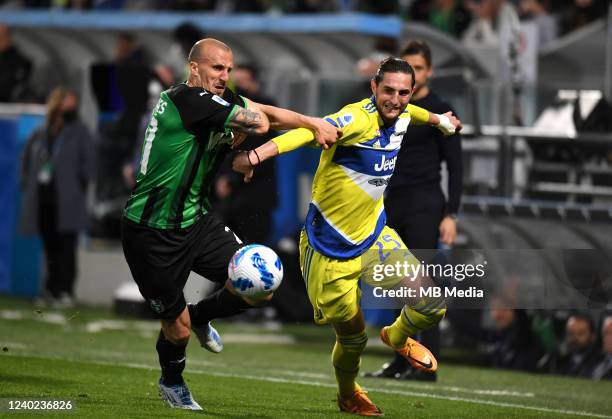 Adrien Rabiot of Juventus competes for the ball with Vlad Chiriches of US Sassuolo during the Serie A match at Mapei Stadium - Citta' del Tricolore...