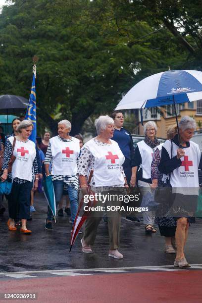 Red Cross members walking alongside one another during the march. Holland Park-Mount Gravatt RSL branch organised a local ANZAC Day march and service...